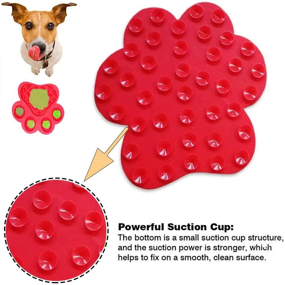 Blue silicone dog licking mat with bone-shape texture and suction cups on a tiled wall.