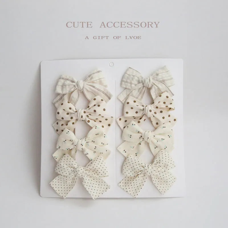 Children's eight-piece cloth bow hairclip set in dovetail shape with multiple colour options