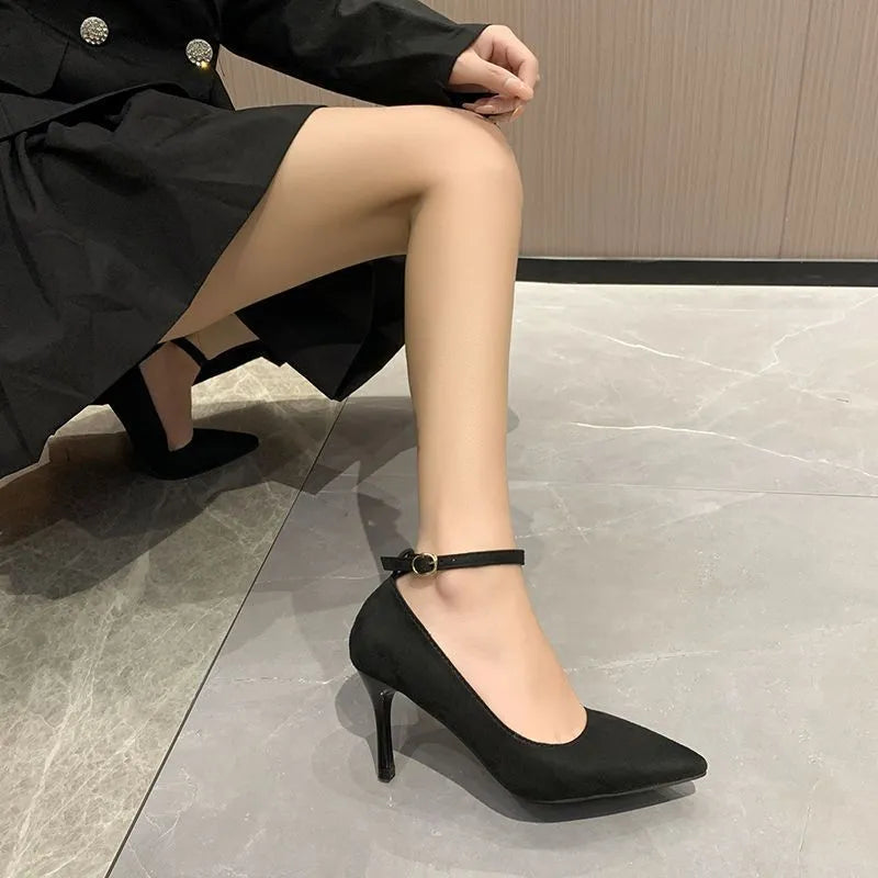 Women's black stiletto pump with buckle closure on 8cm heel