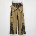 Women's dark khaki leopard print high waist straight leg jeans with retro tooling style details.
