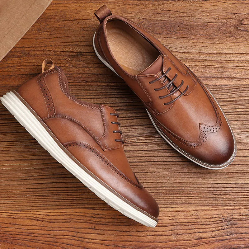 Men's black slip-on business casual shoes with round toe and decorative carving details