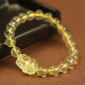 Yellow Chinese pi xiu bracelet with artificial crystal beads on leather cord