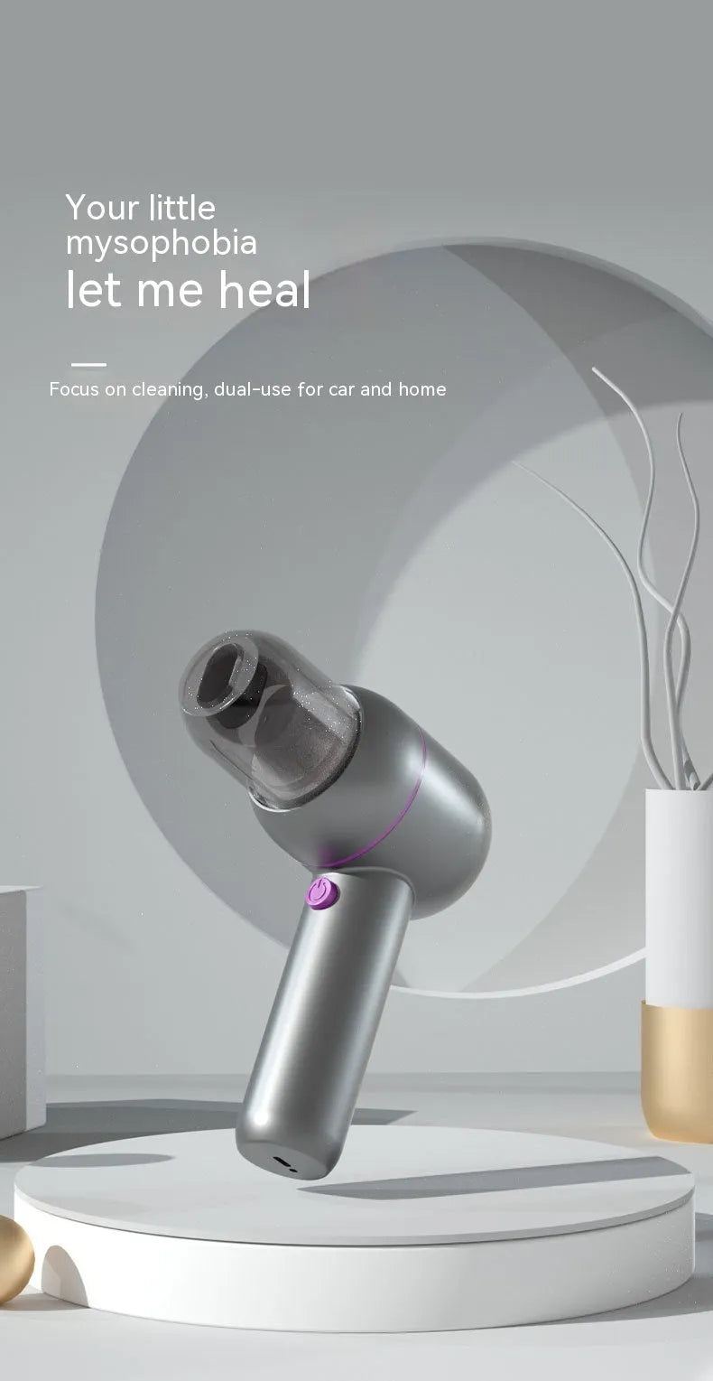 Grey handheld portable car vacuum cleaner with brush nozzle and extended nozzle for dust removal and inflation.