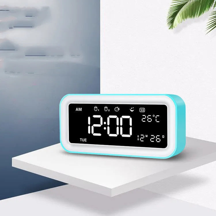 Blue rectangular LED atmosphere light alarm clock with digital display on quartz glass.