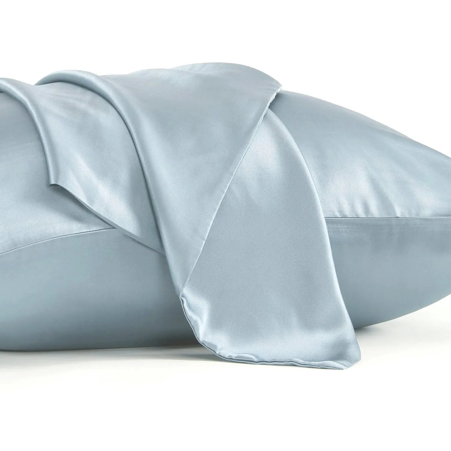 Dark grey silk pillowcase with envelope closure on a bed