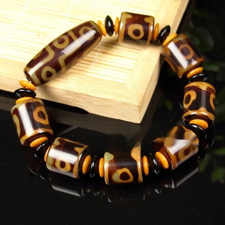 Agate Tibetan dzi bead bracelet with three-eye design and polished finish