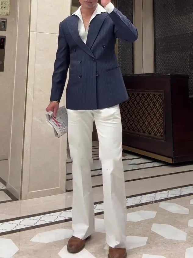 Men's striped double breasted blazer on hanger showing regular fit and classic design