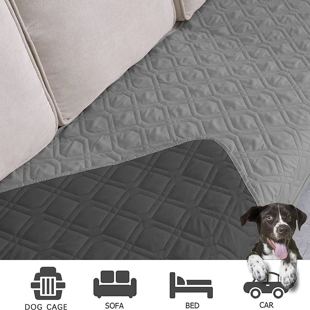 Reversible dog blanket showing two colours, laid flat on a sofa as a protective cover