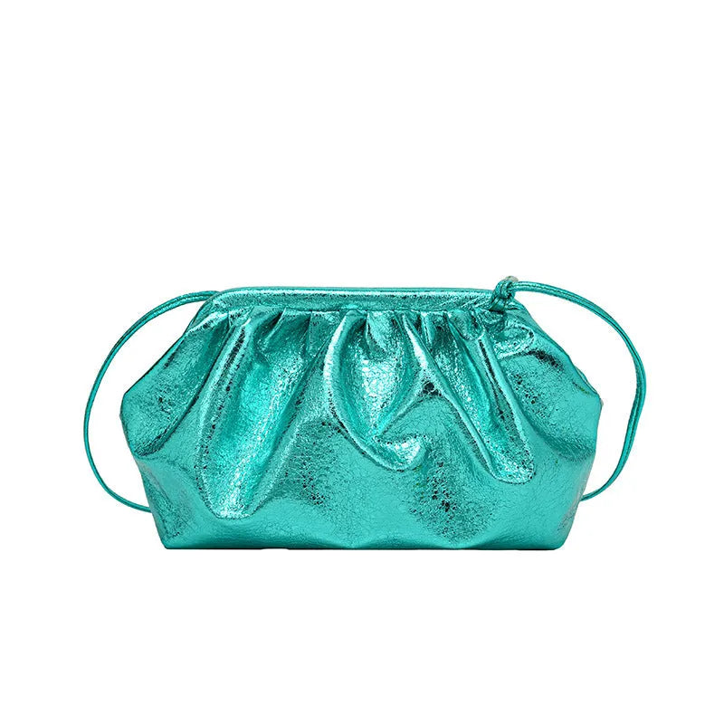 Shell-shaped shoulder crossbody bag with hair clip closure in rose red colour showing interior organisation compartments