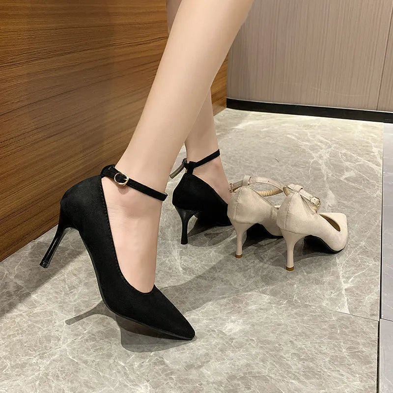 Women's black stiletto pump with buckle closure on 8cm heel