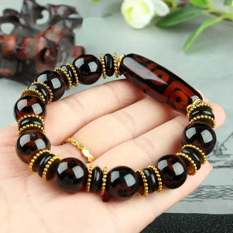 Agate Tibetan dzi bead bracelet with three-eye design and polished finish