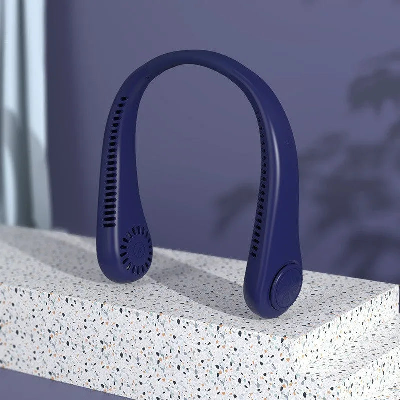 Pink bladeless neck fan being worn, showing soft neckband and compact fan unit.