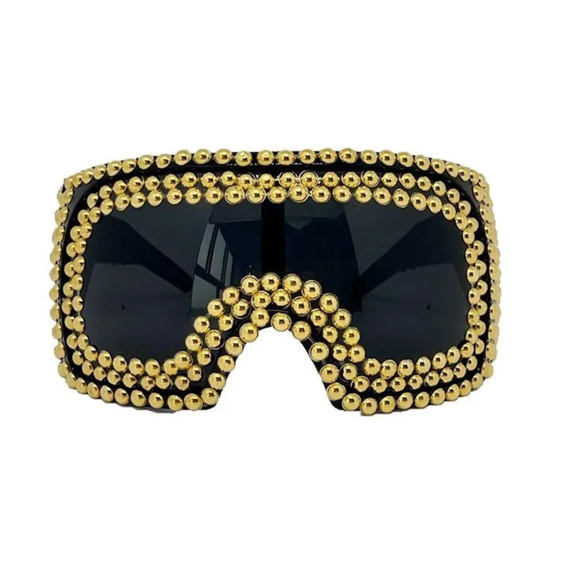 Men's punk style square sunglasses with large rim and rivet detailing in gold colour