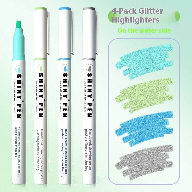 Four glitter highlighter pens with pastel colours and slanted tips on a notebook.