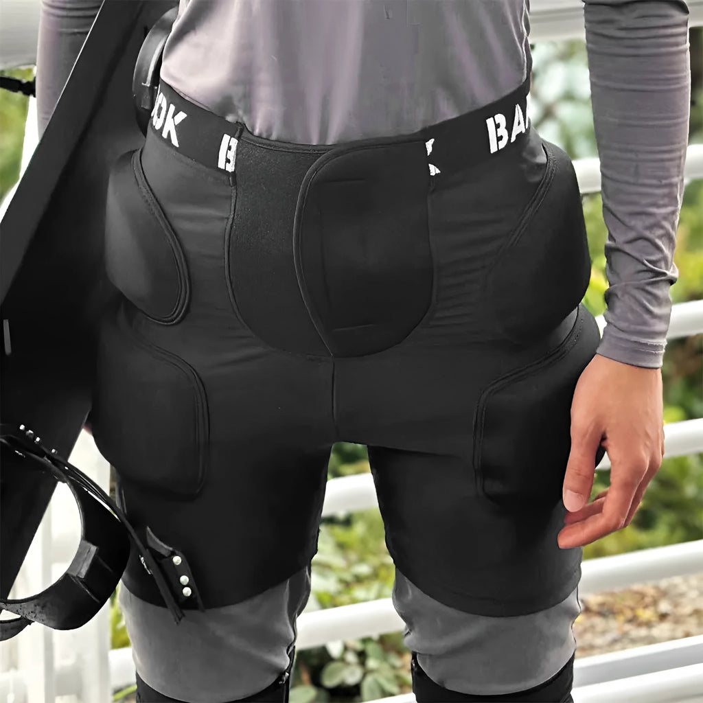 Black spandex hip protection pad with removable NBR foam inserts for skating and skiing safety.