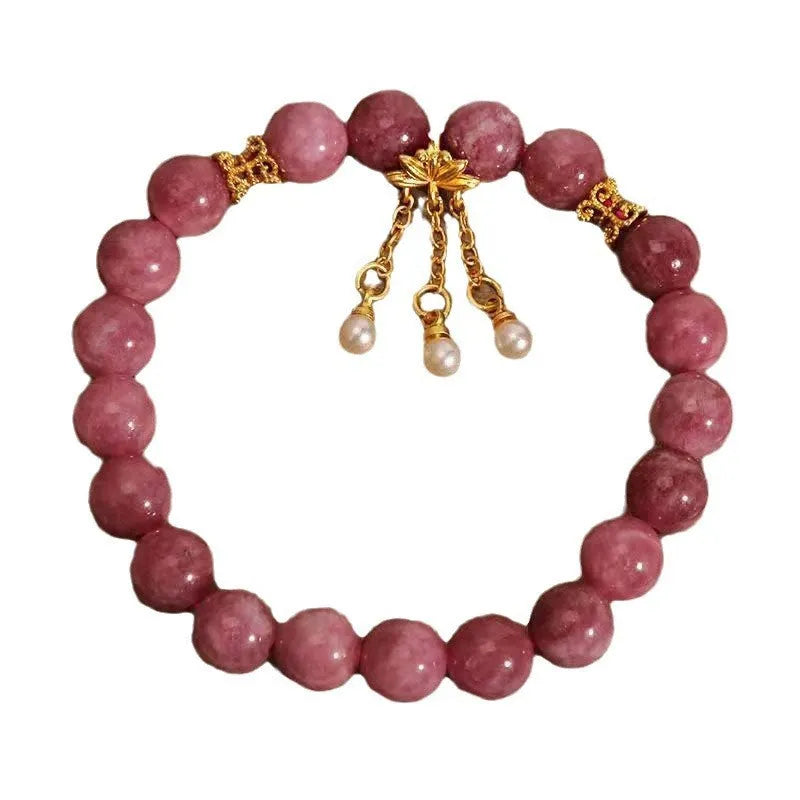 Women's natural stone bracelet with pearl pendant and pink lotus tassel on wrist
