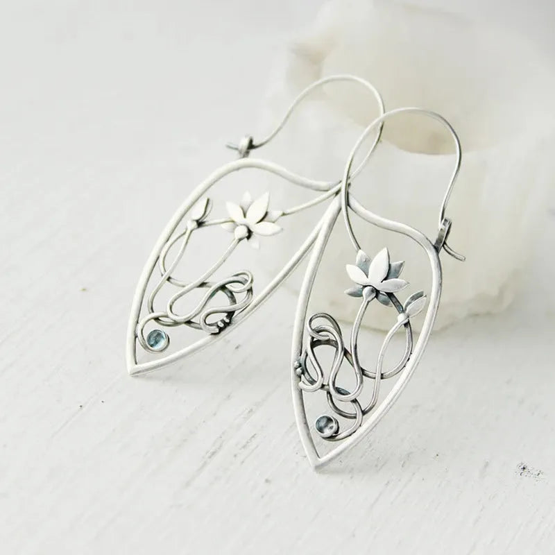 Silver electroplated lotus vine earrings with floral design and geometric round elements