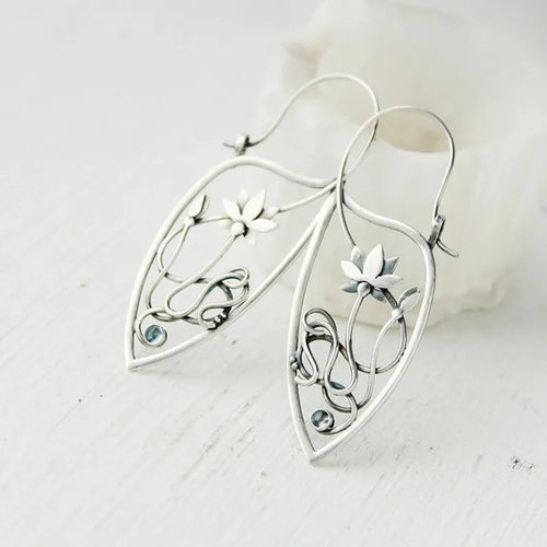 Silver electroplated lotus vine earrings with floral design and geometric round elements