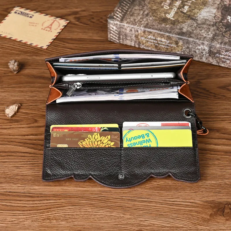 Women's brown tri-fold cowhide wallet with embossed floral pattern, shown open and closed.