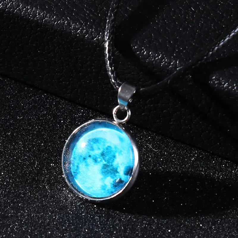 Luminous moon and constellation design pendant on an alloy necklace chain with extension.