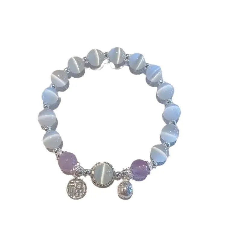 Women's glass butterfly drop-shape bracelet in a grey colourway with round details.