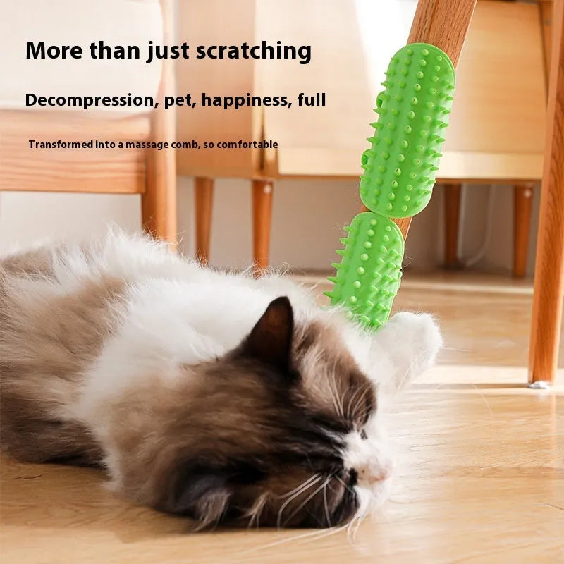 Silicone cat grooming comb with adjustable strap mounted on a table leg, shown in green colour.