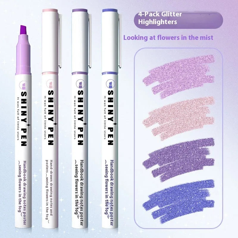 Four glitter highlighter pens with pastel colours and slanted tips on a notebook.