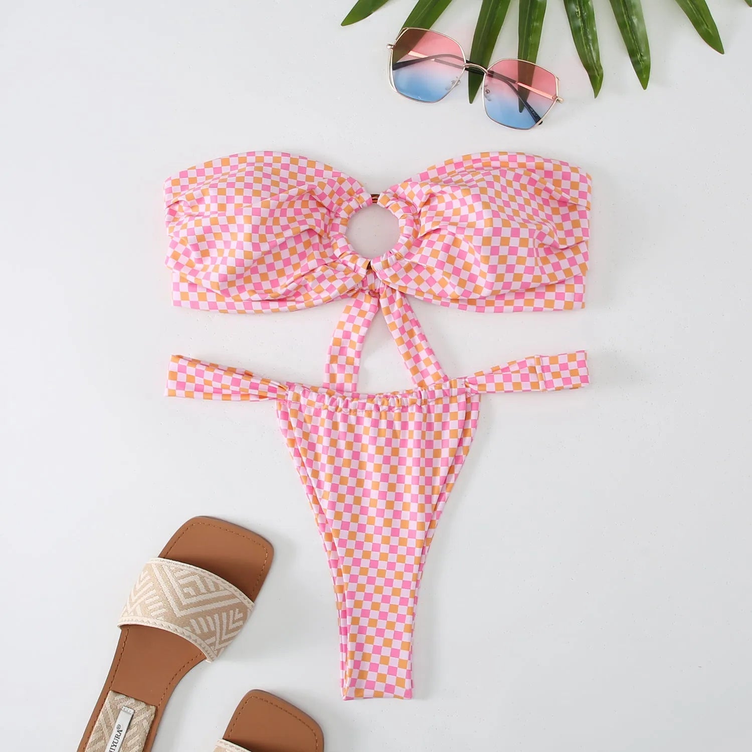 Women's floral printed tube top ring bikini set with backless design on mannequin