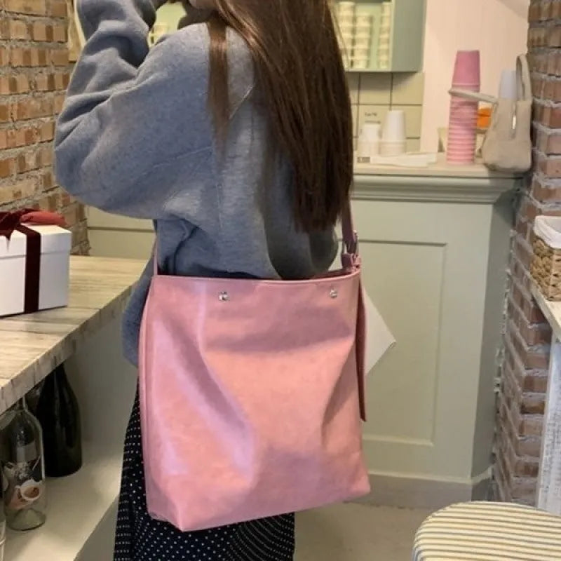 Corduroy one-shoulder commuter bag with PU lining in pink or brown, showing 39cm length dimensions