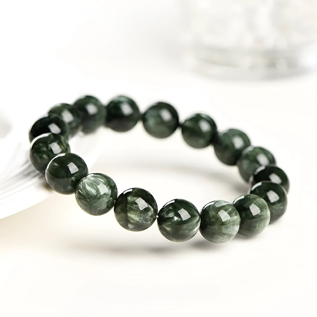 Green dragon crystal bracelet with 8-9mm round beads featuring geometric and Ruyi designs
