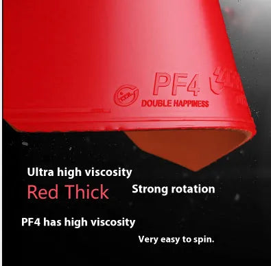Fast Attack Sticky Classic-50 table tennis racket with red PF4-50 anti-rubber on a wooden table.