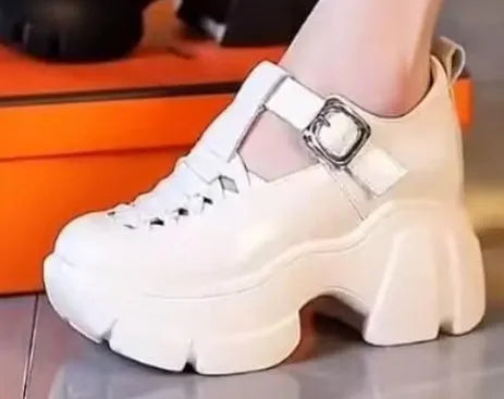 Women's black and white satin pumps with chunky wedge heel and hollow-out design