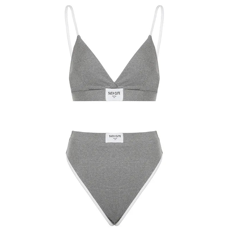 Women's embroidered bikini set with contrast binding letters in black colour showing sleeveless top and shorts