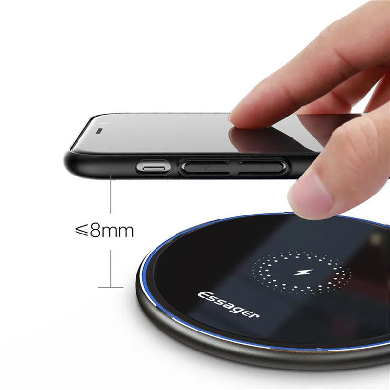 Black and white aluminium wireless charger showing LED indicator lights and anti-slip surface