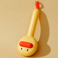 Small yellow duck-shaped pet comb with open sections and floating needles for cat and dog hair removal