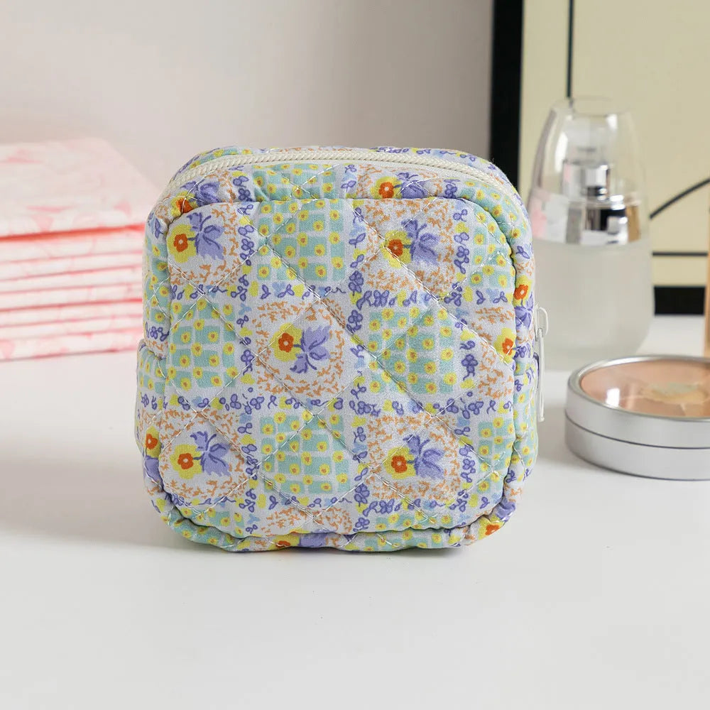 Floral polyester key storage bag with sewing thread detailing in multiple colour patterns