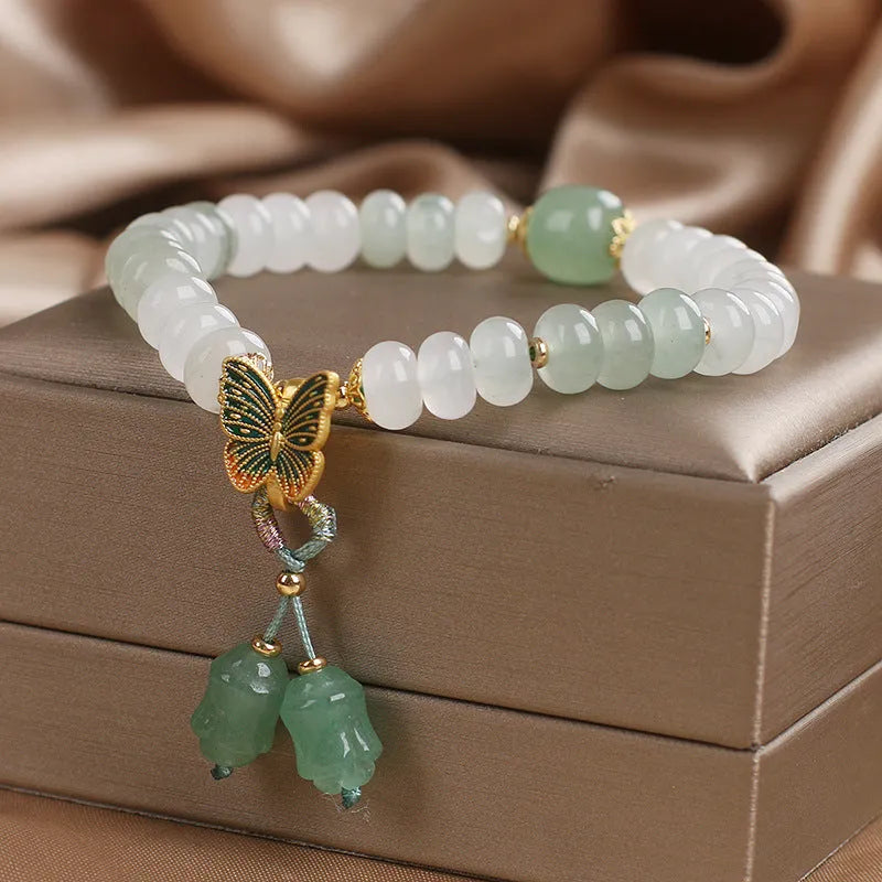 Green crystal women's bracelet with Tian Shan Cui abacus beads and retro butterfly tassel design measuring 17 cm