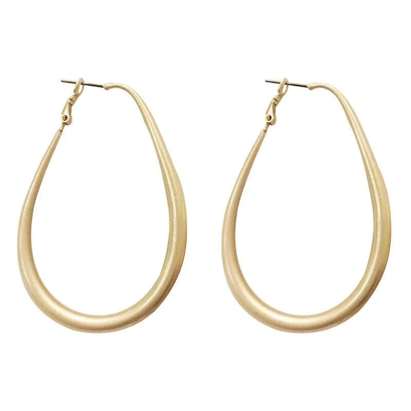 Matte gold geometric ellipse alloy earrings with electroplated finish, vintage French cold wind style for women