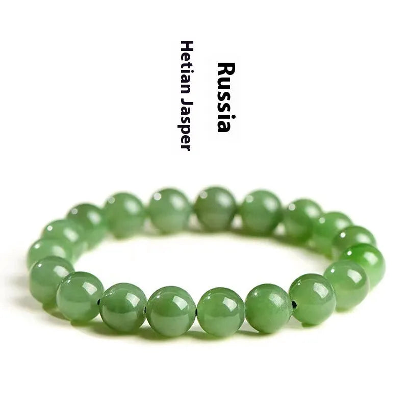 Natural Hetian jade bead bracelet in jasper colours, showing polished beads on a wrist.