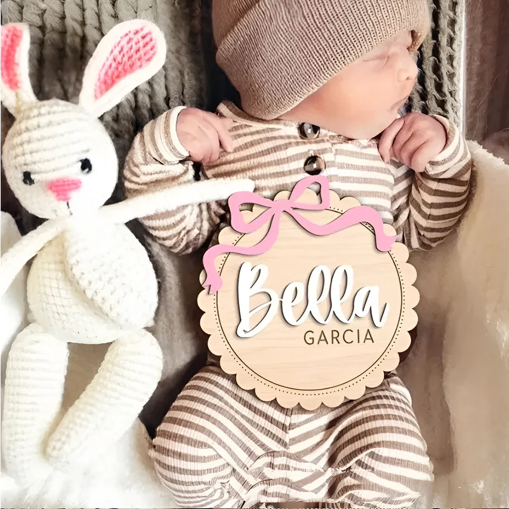 Square wooden ornament laser-engraved with a custom name for baby room decoration.