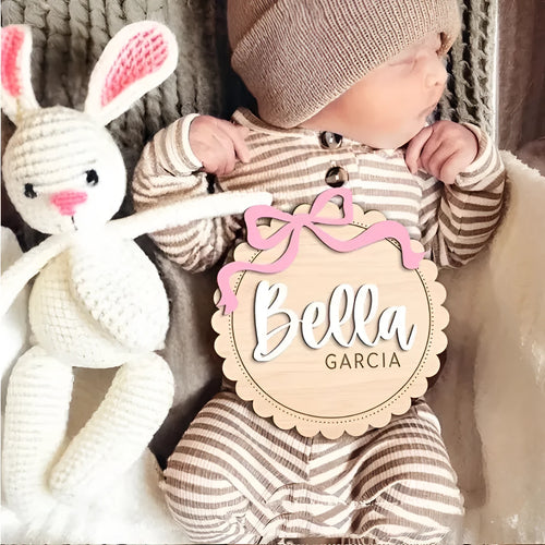 Square wooden ornament laser-engraved with a custom name for baby room decoration.