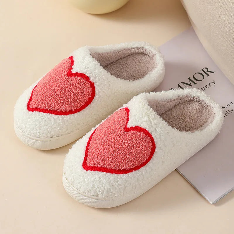 Plush home slippers with cartoon designs and non-slip PVC soles in adult female sizes