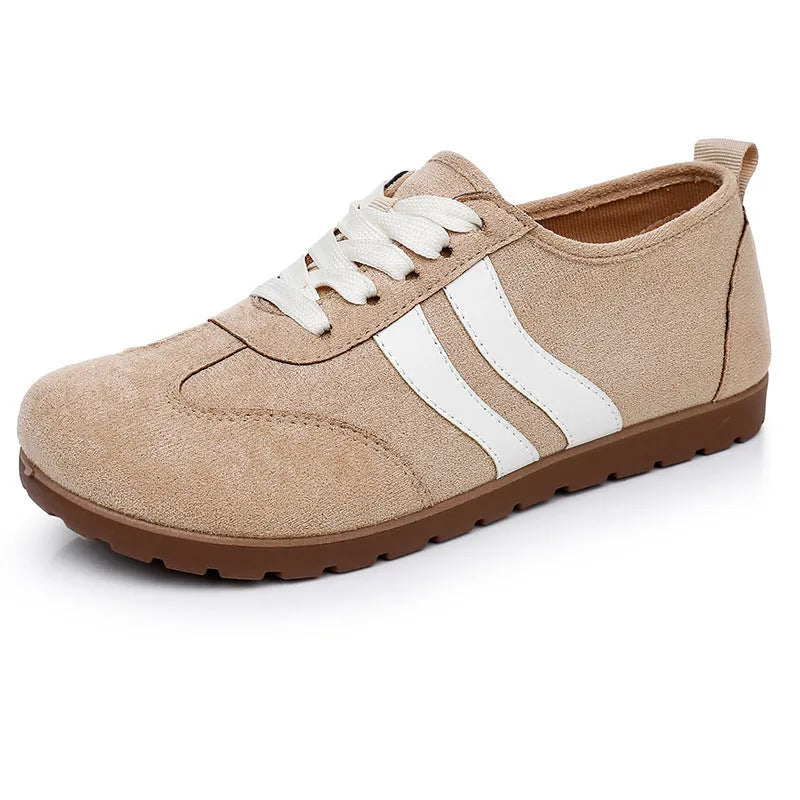 Women's vintage canvas sneakers in dark red with a round toe and soft rubber sole.