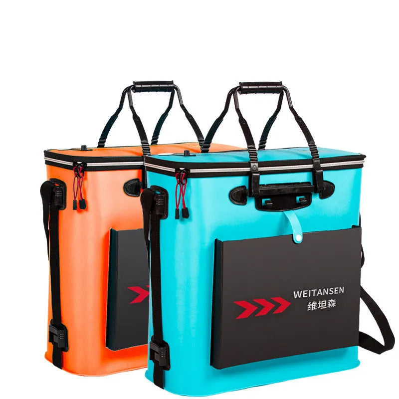 Foldable blue EVA fishing box live fish bucket measuring 42x42x21cm on a grassy bank