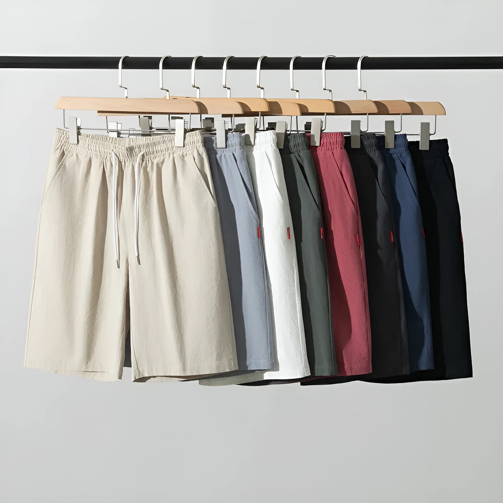 Solid colour cotton linen cropped summer pants with a drawstring waist on a hanger.