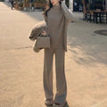 Women's beige acrylic sweater and wide-leg pants two-piece set laid flat.