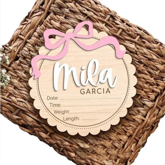Square wooden ornament laser-engraved with a custom name for baby room decoration.