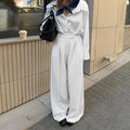 White striped wide-leg commuting trousers with front zipper detail and loose fit