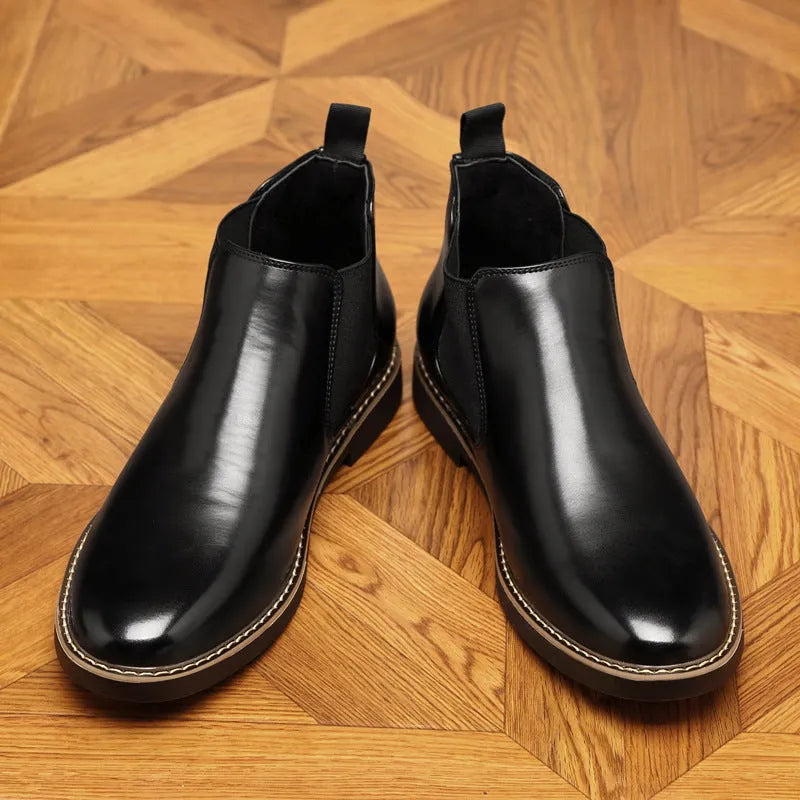 Black and brown formal men's pointed-toe leather boots with a square rubber heel.