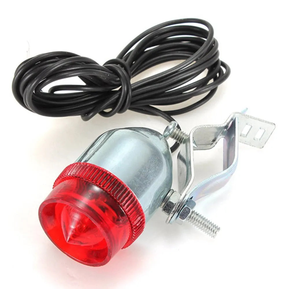 Silver aluminium bicycle dynamo light kit with generator, headlight, and tail light for friction-powered illumination.